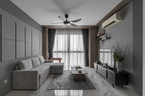 Departamento Deluxe, vista a la ciudad | Área de sala de estar