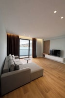 Apartment Balcony Partial Sea View | Tabla de planchar con plancha y ropa de cama