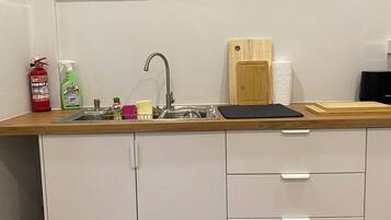 Fridge, microwave, stovetop, coffee/tea maker