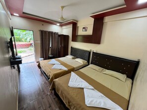 Family Single Room, Garden View | Blackout curtains, free WiFi - Coral Beach Resort (Diveagar)