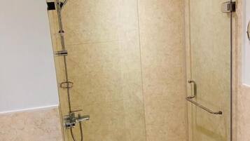 Separate bathtub and shower, free toiletries, hair dryer, slippers