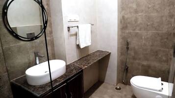 Deluxe Double Room, Air conditioning | Bathroom | Shower, rainfall showerhead, slippers, towels