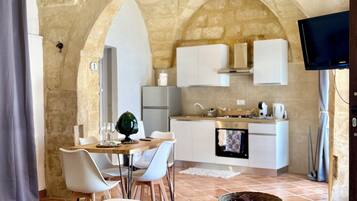 Comfort Studio Suite | Living area | 40-inch flat-screen TV with cable channels