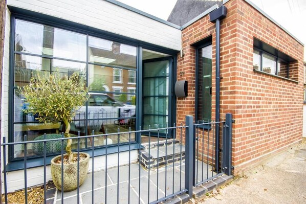 A modern building with large windows, a brick facade, and a metal fence. - The Old Bakery, Golden Triangle, Norwich.
Great Location (Norwich)