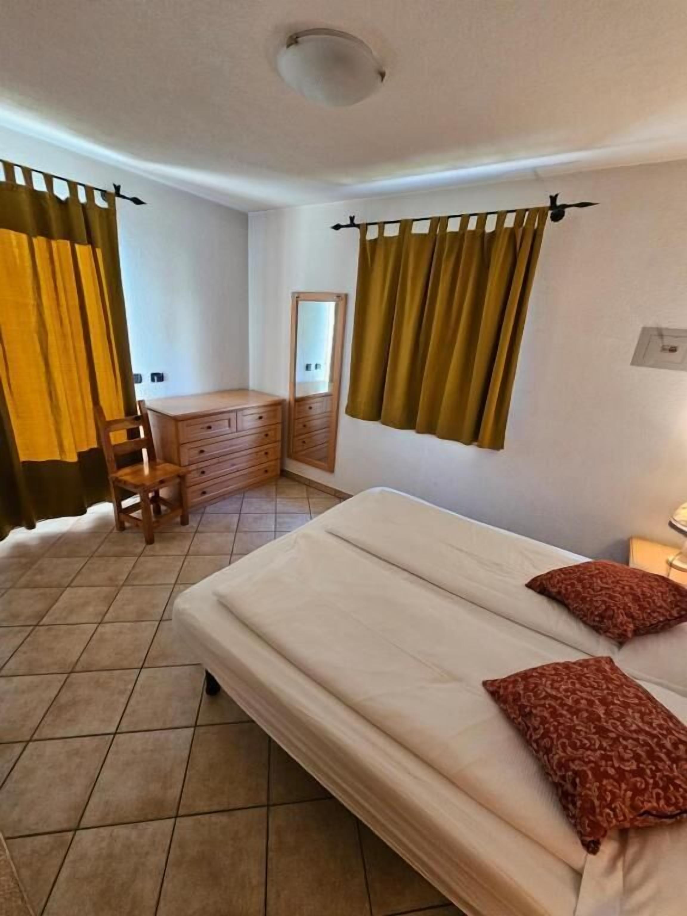 Appartamento, vista giardino | Una cassaforte in camera, Wi-Fi gratuito