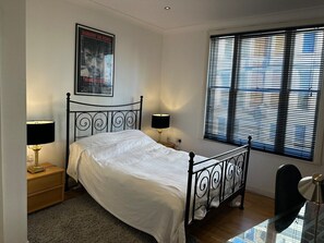 Luxury Apartment | Desk, laptop workspace, blackout curtains, iron/ironing board