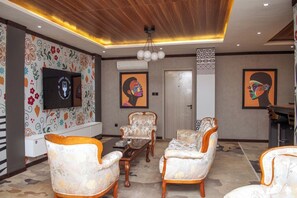 Superior Suite, Pool View | In-room safe, soundproofing, iron/ironing board, free WiFi