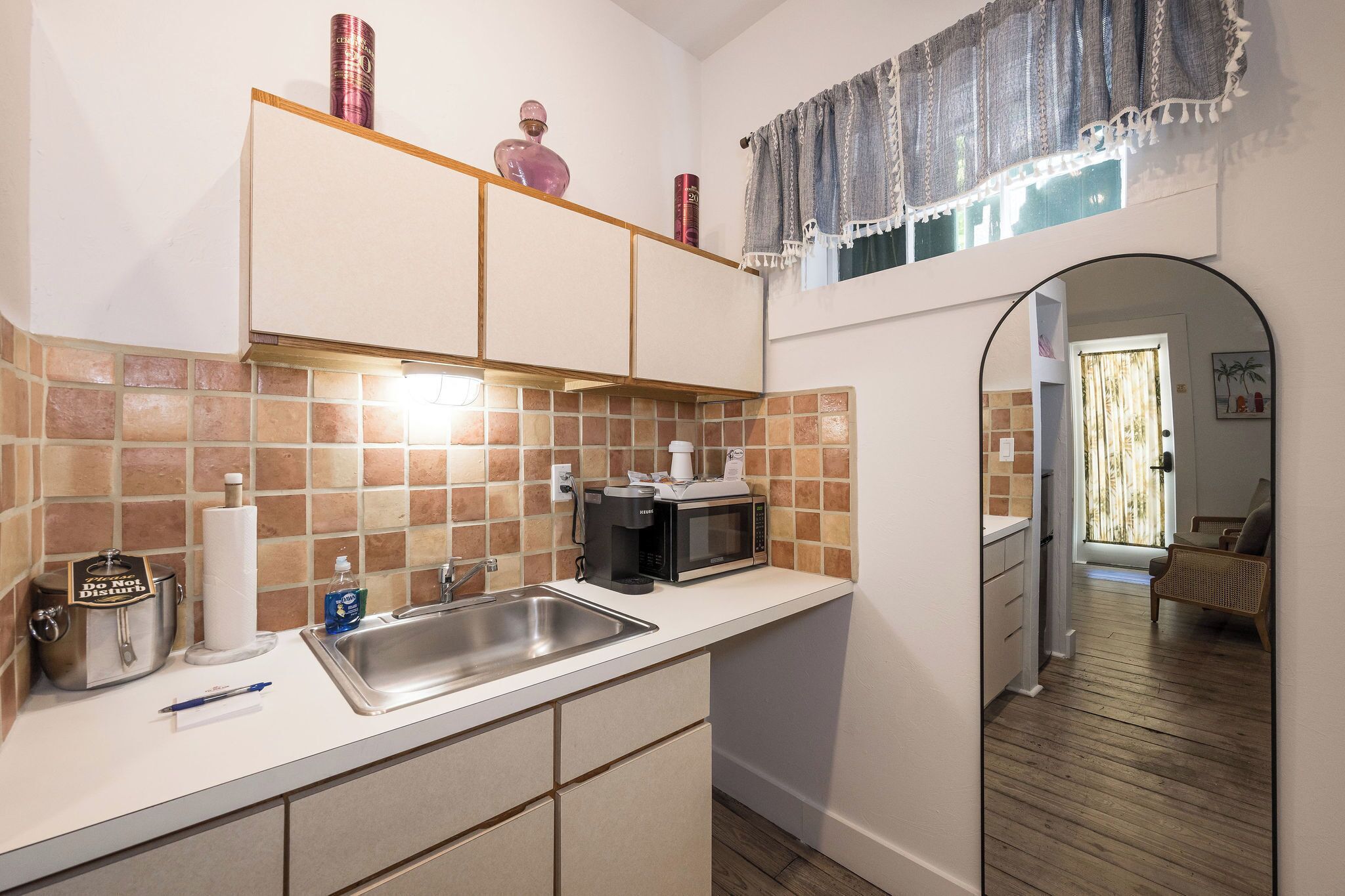 Fridge, microwave, coffee/tea maker, cookware/dishes/utensils