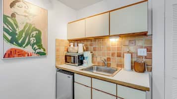 Fridge, microwave, coffee/tea maker, cookware/dishes/utensils