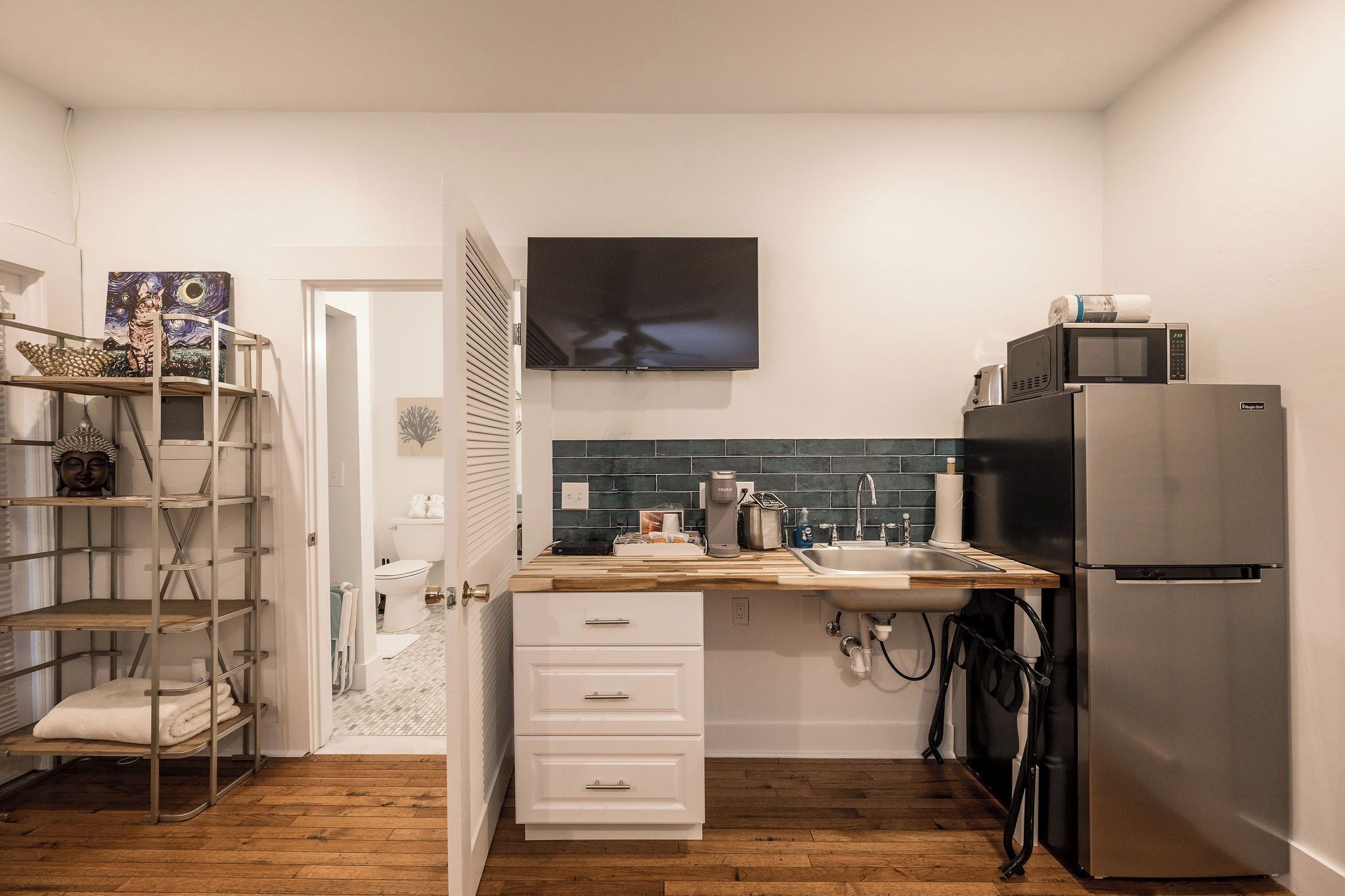 Fridge, microwave, coffee/tea maker, cookware/dishes/utensils