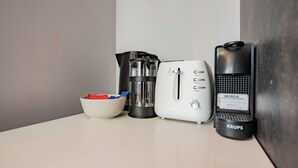 A kitchen counter with a coffee maker, a toaster, and a Krups electric kettle. - Seaside Getaway in Howth (Howth)