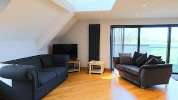 Apartment, 3 Bedrooms (Mendip View) | Living area | 32-inch flat-screen TV with digital channels