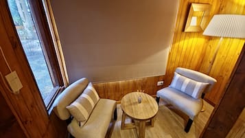 Romantic Loft, Partial Lake View | Living area | 43-inch Smart TV with digital channels