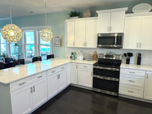 Fridge, microwave, oven, stovetop - Topsail Waterfront Retreat + Panoramic Sunset Views (Topsail Beach)