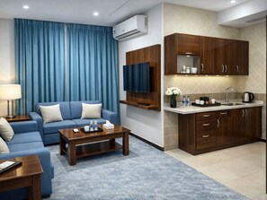 Family Suite | Living area | 42-inch flat-screen TV with digital channels - Aizdihar Suites (Riyadh)