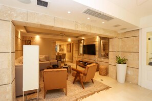 Living area - Escape to the comfort of this beautiful apartment with private jacuzzi 🏡✨ (La Romana)