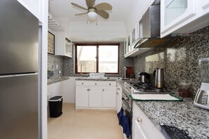 Private kitchen - Escape to the comfort of this beautiful apartment with private jacuzzi 🏡✨ (La Romana)