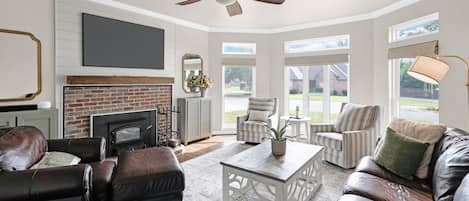 Smart TV, fireplace, books, music library