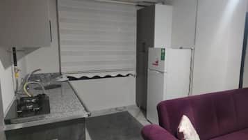 Apartment, Balcony | Private kitchen | Full-size fridge, stovetop, cookware/dishes/utensils