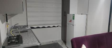 Apartment, Balcony | Private kitchen | Full-sized fridge, stovetop, cookware/dishes/utensils