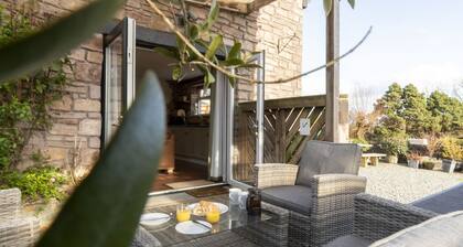 This converted barn with hot tub offers the perfect rural escape