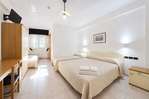 A hotel room with a desk, two beds, a wardrobe, and a window. - B&B with Window - 232 - Santangelo - Pool (Monte Sant'Angelo)