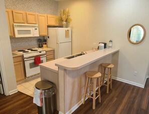 Fridge, microwave, oven, stovetop - Beach Town Resort first floor 1-bedroom condo in Sunset Beach (Sunset Beach)