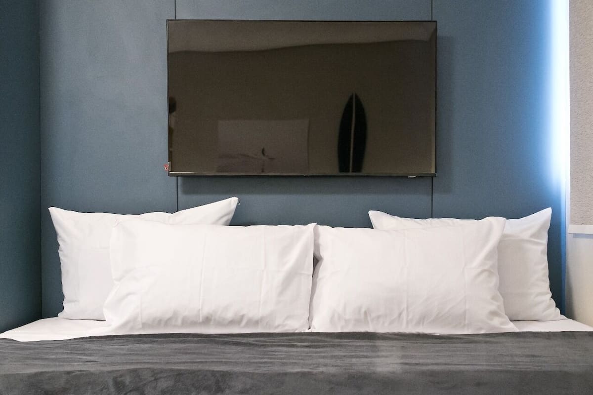 Departamento Deluxe, cocina, vista a la ciudad | Wifi gratis y ropa de cama