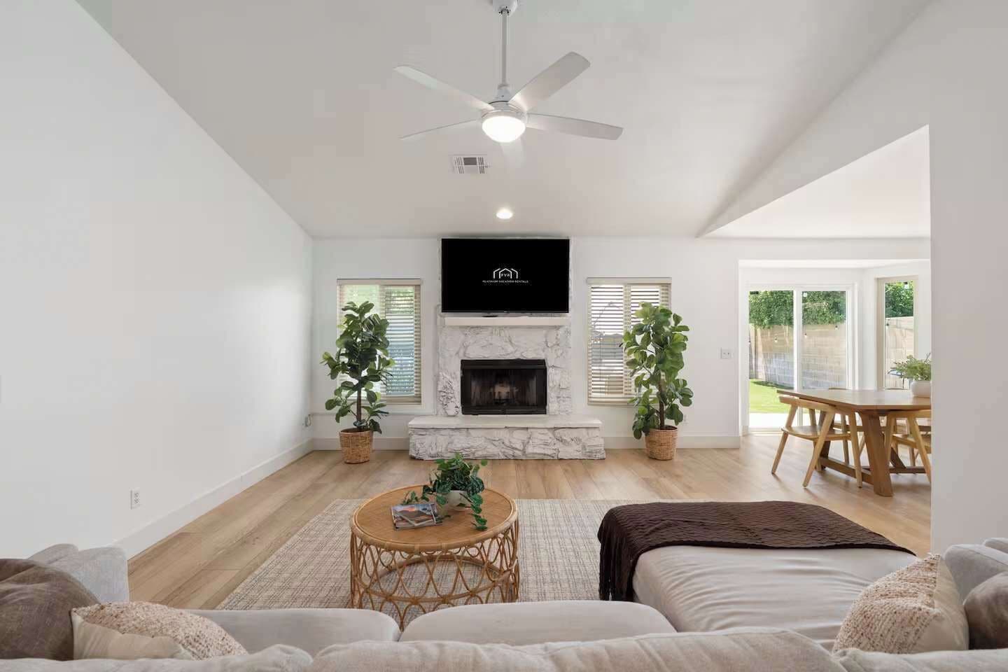 Living room with decorative fireplace and comfy sectional
