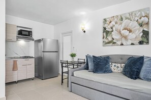 Apartment, 2 Bedrooms | Living area | 32-inch flat-screen TV with digital channels