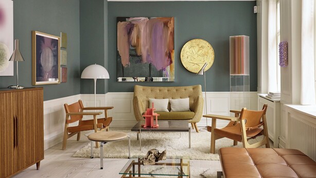 A living room with a sofa, chairs, a coffee table, and a fireplace. - The Darling (Copenhagen)