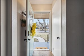 A door leading to a covered porch with a mailbox and a small plant on the wall. - Spacious & well designed 3br/1.5ba w/ Fiber Wi-Fi! (Toledo)