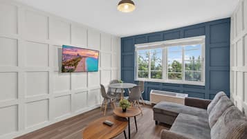 Elite Apartment, Garden View | Living area | 50-inch Smart TV with digital channels
