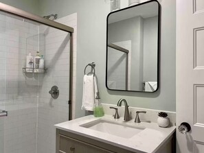 Shower, hair dryer, towels, soap