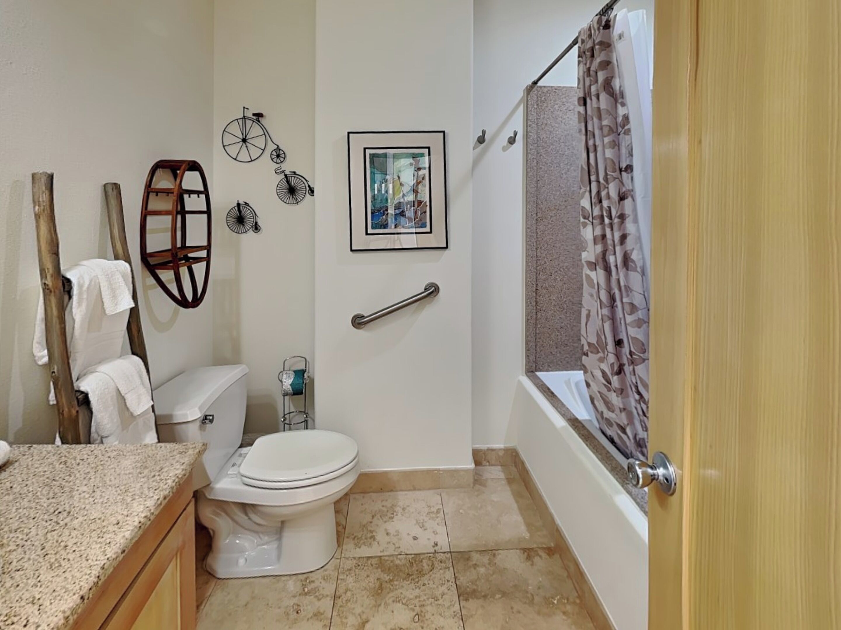 A bathroom with a toilet, sink, and bathtub.