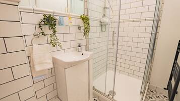 Shower, hair dryer, towels, soap