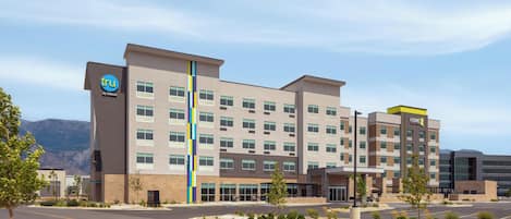 A multi-story hotel with a modern design, featuring a prominent vertical stripe on the facade.