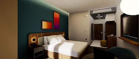 A modern hotel room with a bed, bedside table, lamp, and a desk with a chair.