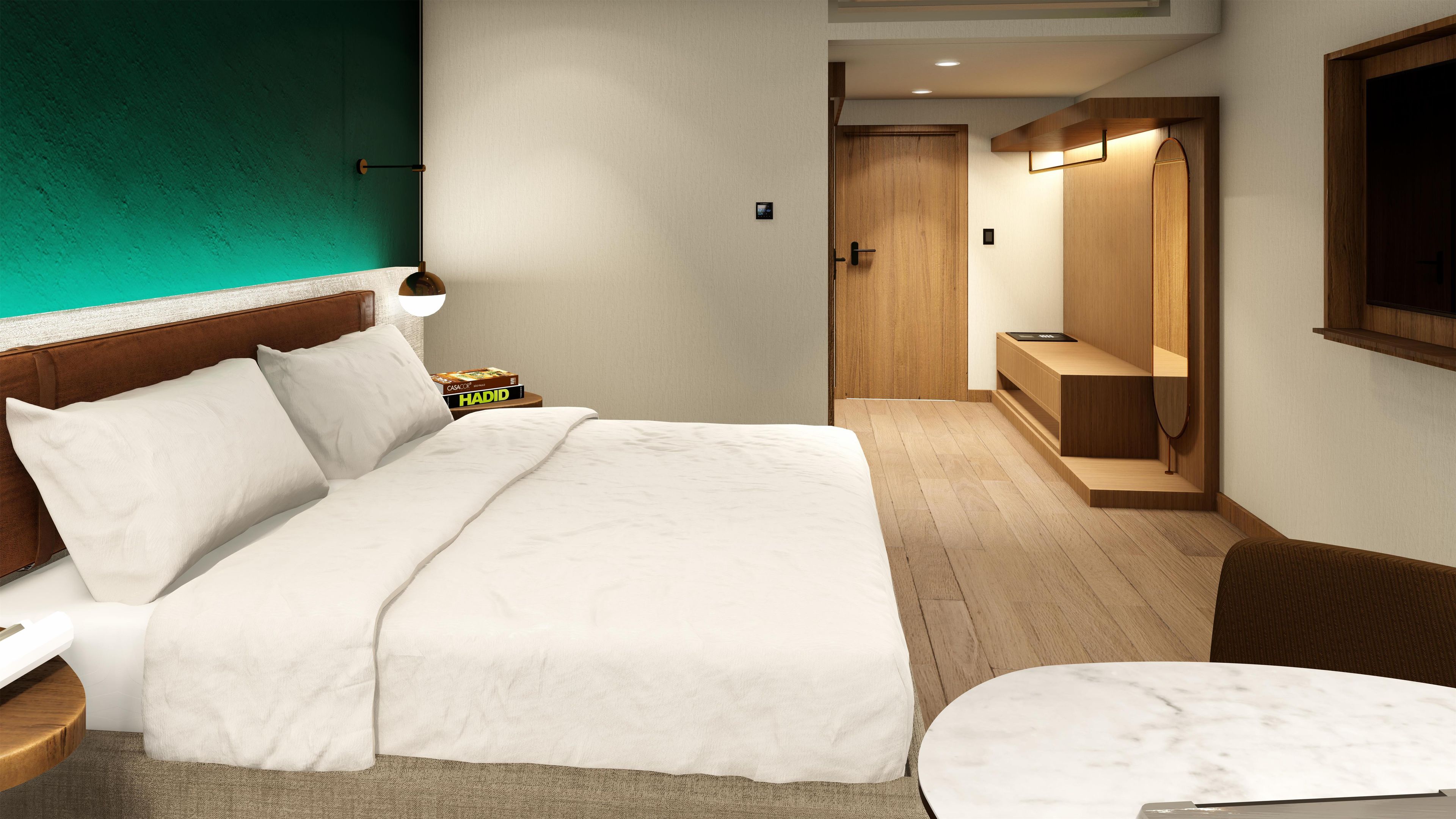 A hotel room with a bed, a nightstand, a bedside table, a chair, a desk, and a television.