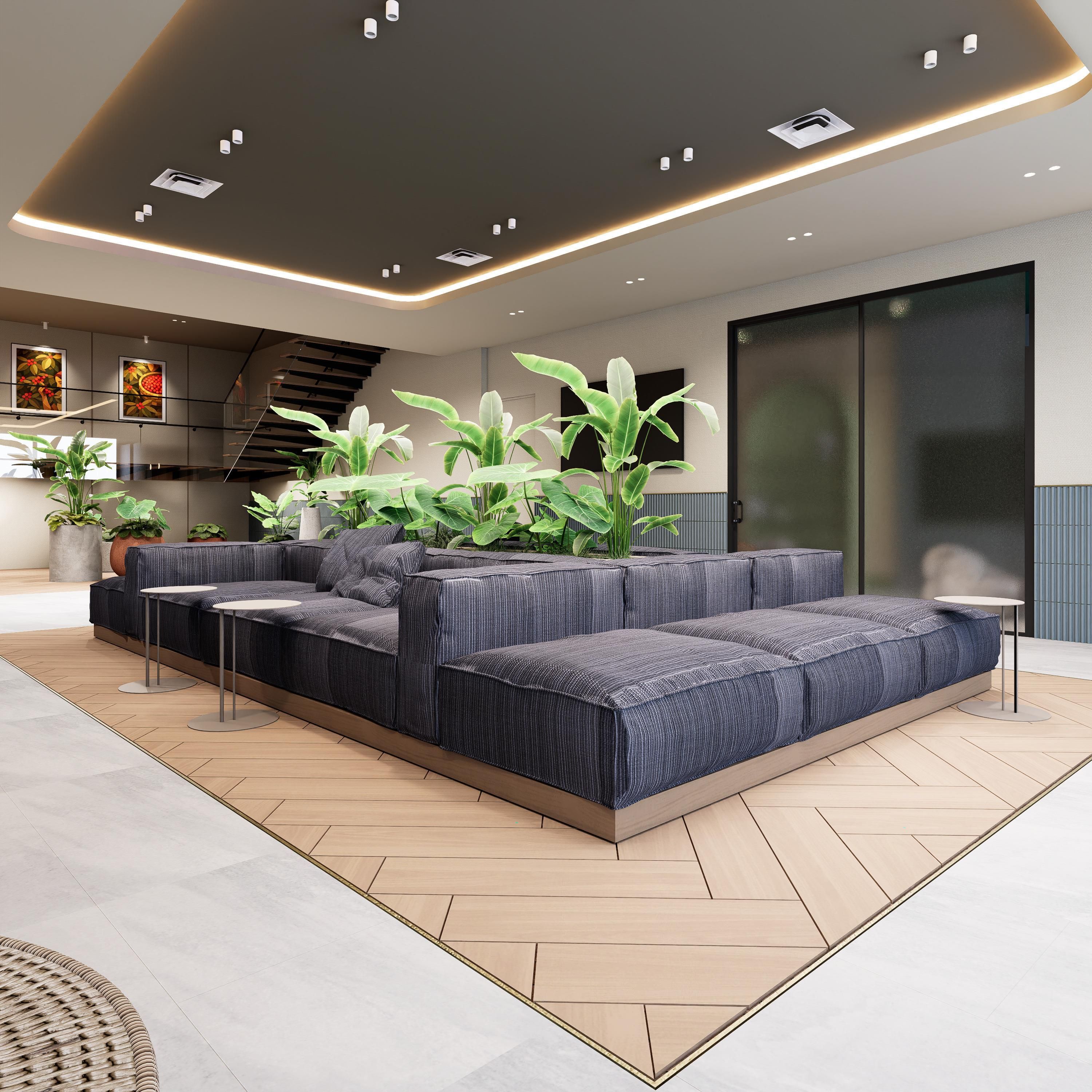 Una sala de estar moderna con un sofá modular, plantas en macetas y una escalera.
