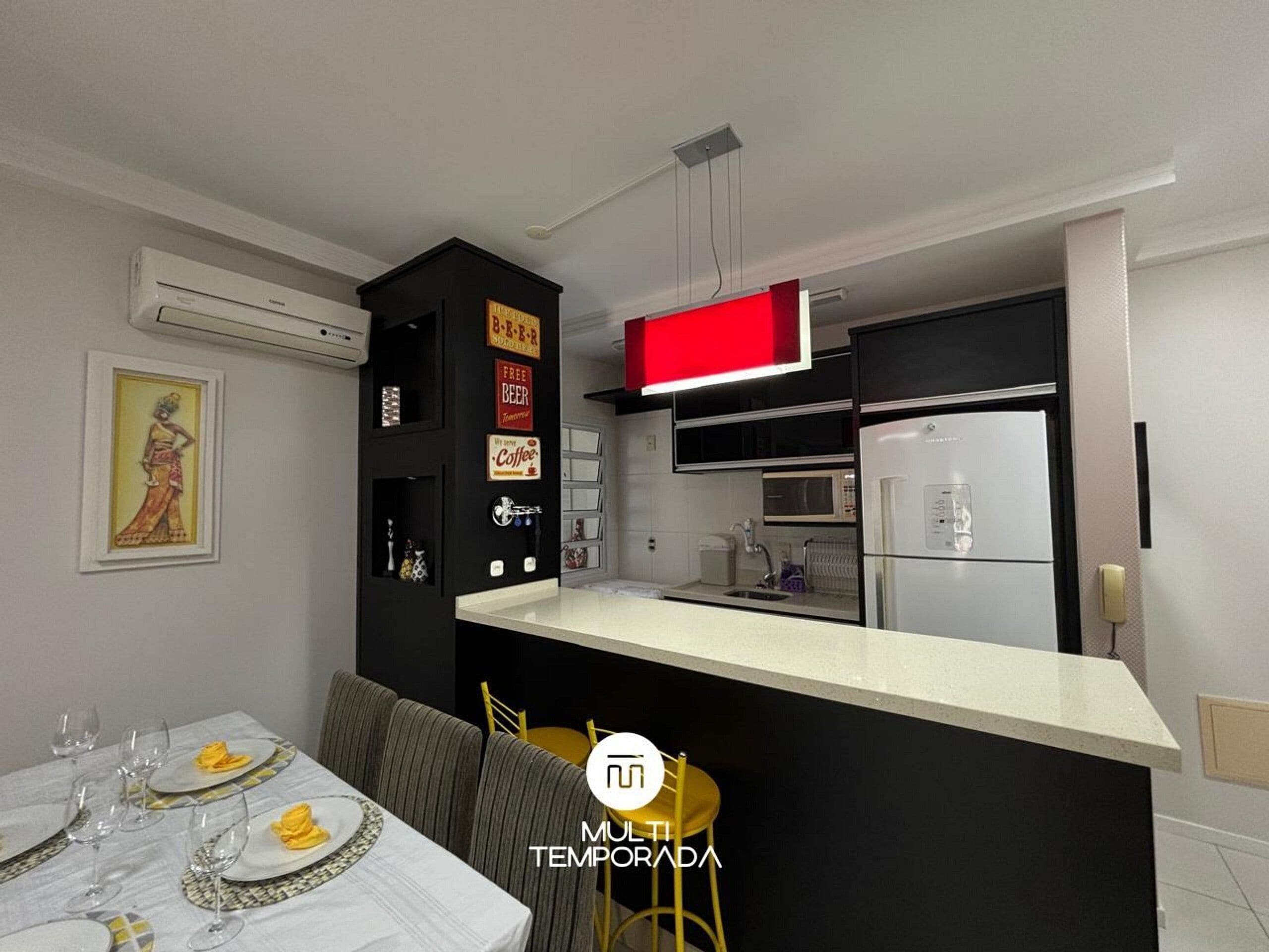 Deluxe Apartment | Private kitchen | Fridge, microwave, cookware/dishes/utensils, dining tables