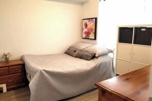 A bedroom with a bed, a nightstand, a dresser, and a wardrobe. - New Yorkville Condo Great Location + Gym and Pool! (Toronto)
