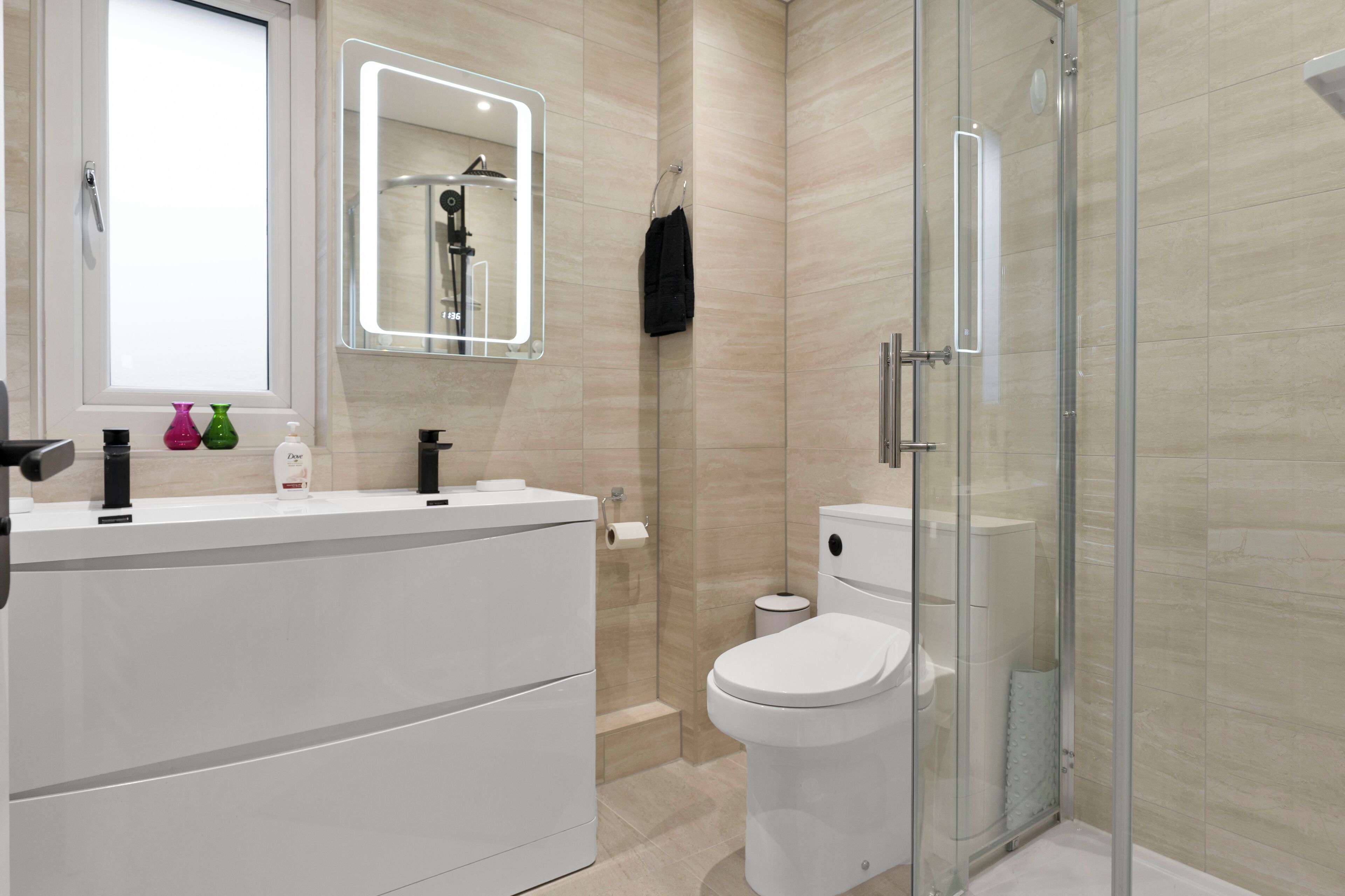 Shower, hair dryer, towels, soap