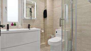 Shower, hair dryer, towels, soap