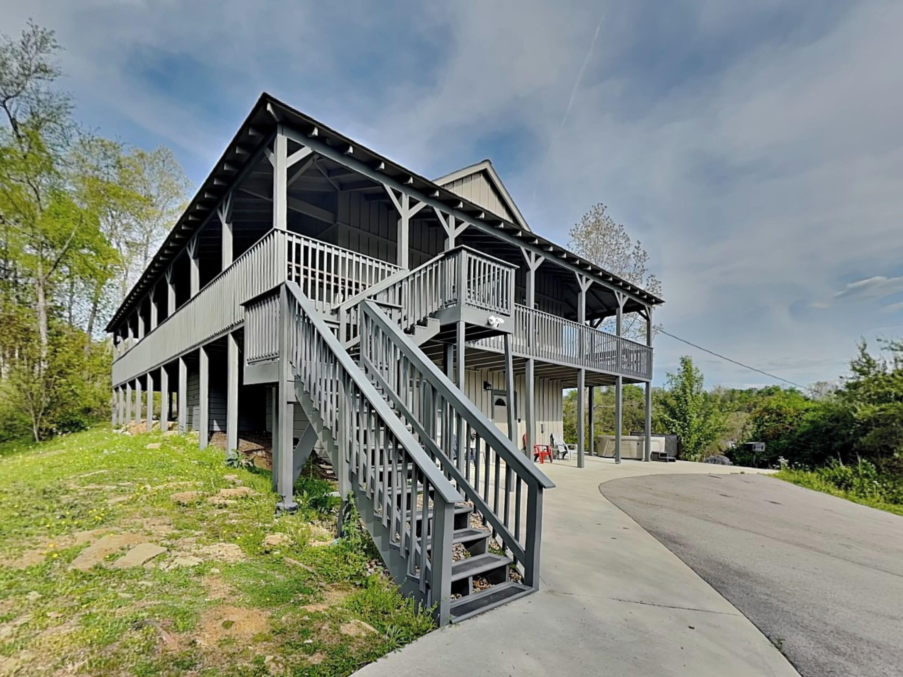 A two-story building with a balcony and a staircase.