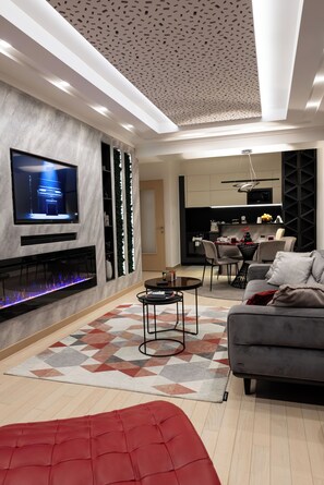 Smart TV, fireplace, books, stereo - Flatiron Signature Luxury Suite – City View – 2-Bedroom Apartment (Skopje)