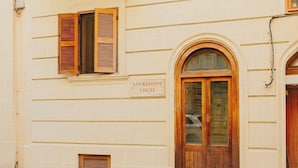 A building with a sign reading "Lockestone Court." - Cozy One-Bedroom Penthouse in Sliema (Tas-Sliema)