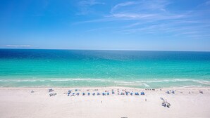 A beach with clear skies and turquoise water. - Boardwalk Beauty: stunning 17th floor condo with private balcony & bunk room (Panama City Beach)
