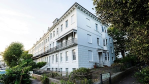 A multi-story building with a white facade, a balcony on the second floor, and a sign reading "Montpelier Villas". - Spacious 2 Bed Apartment in Brighton with Parking (Brighton and Hove)