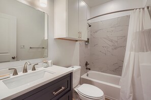 Hair dryer, towels, soap, toilet paper